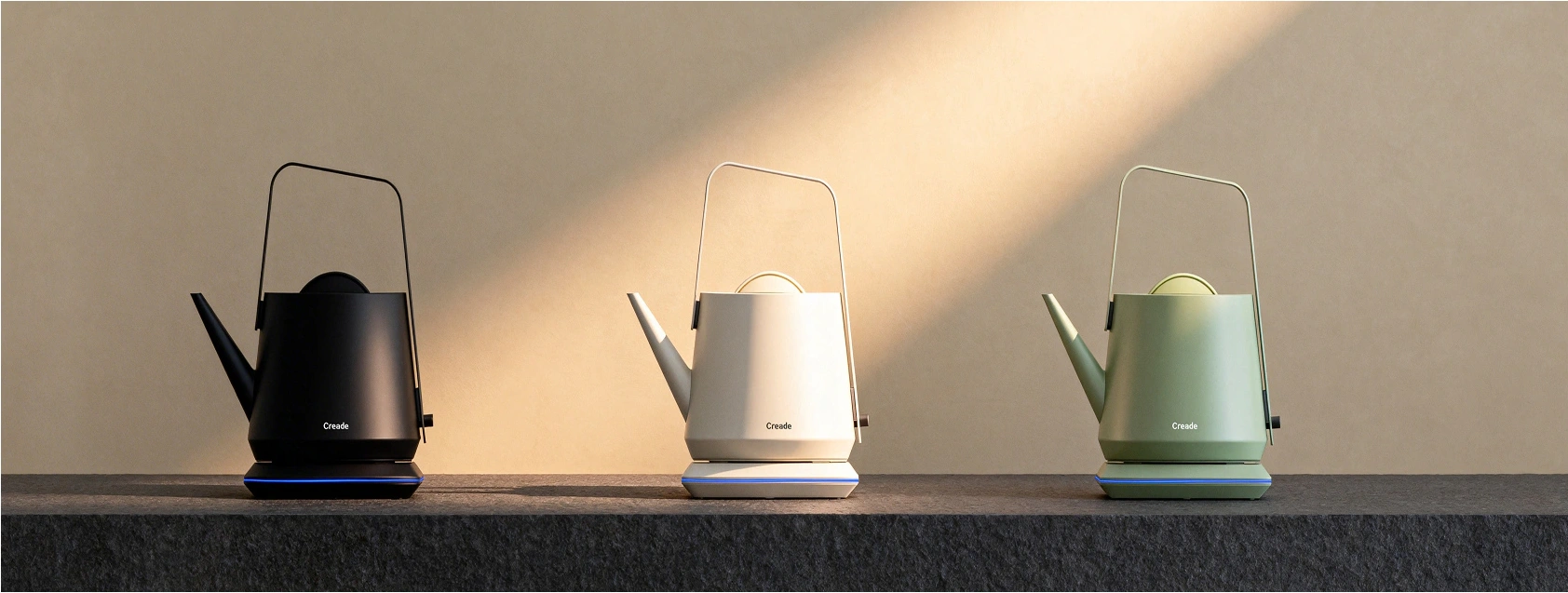 Black, white and green Creade electric kettles