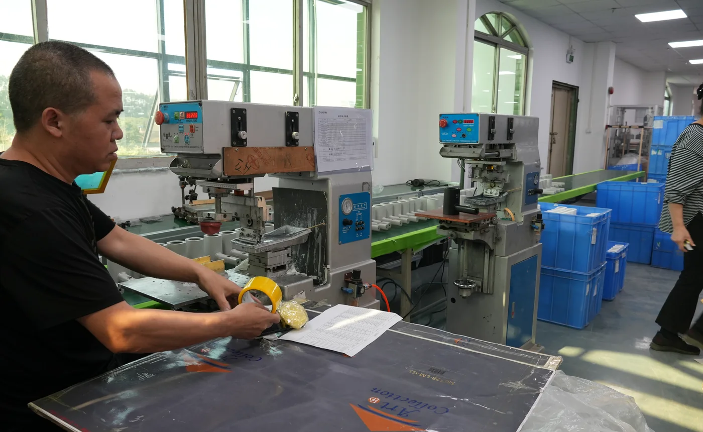 Technician operating production equipment for customized manufacturing
